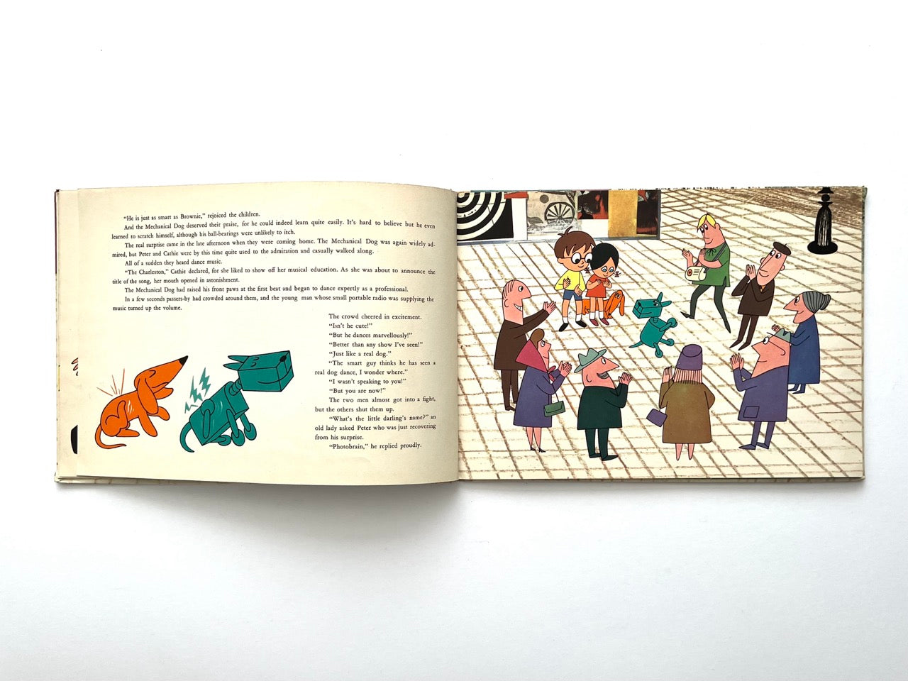 Brownie and the Mechanical Dog by György Várnai, 1976 – lively street scene with crowd watching the dancing mechanical dog and children.