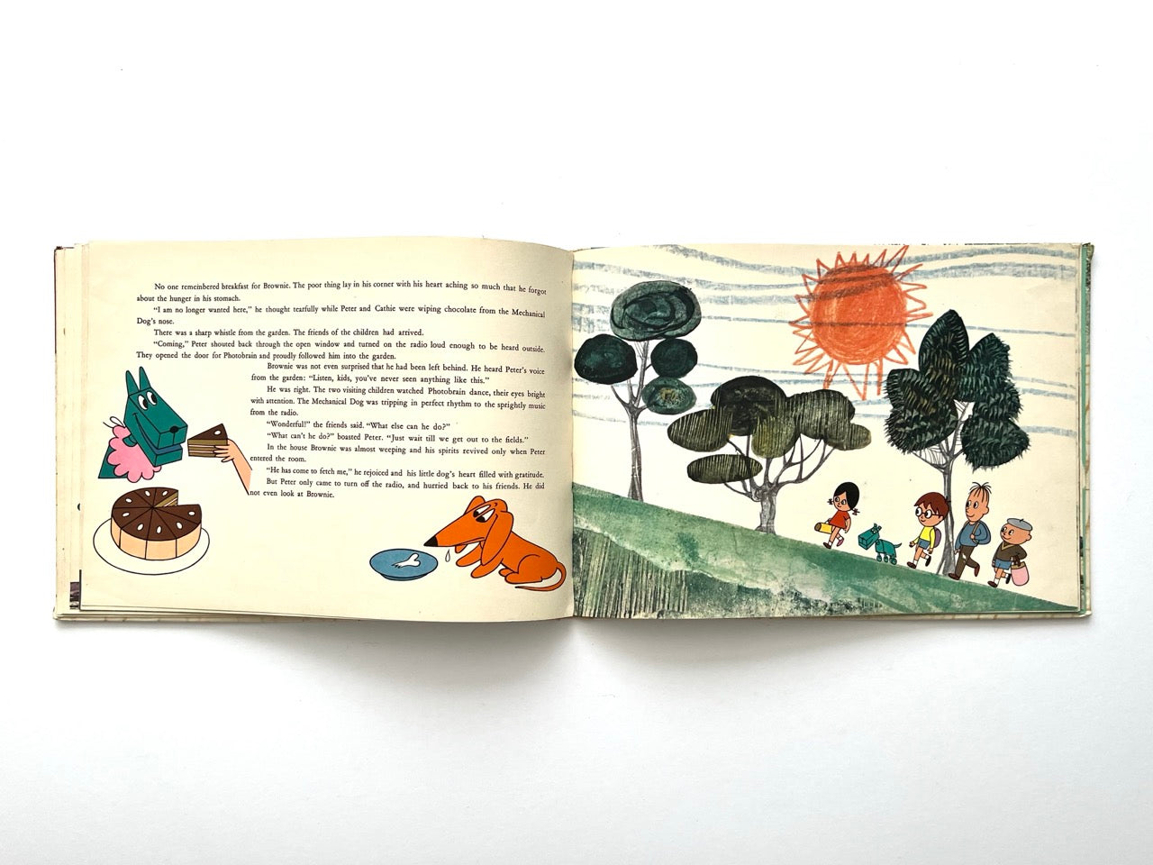 Brownie and the Mechanical Dog by György Várnai, 1976 – closing illustration of children walking with both dogs in a stylised landscape with trees and sun.