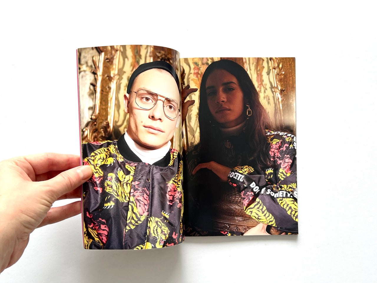 Doomsday Society Issue No. 01 – Interior spread with close-up portraits of two models wearing patterned jackets with bold floral and graphic prints.