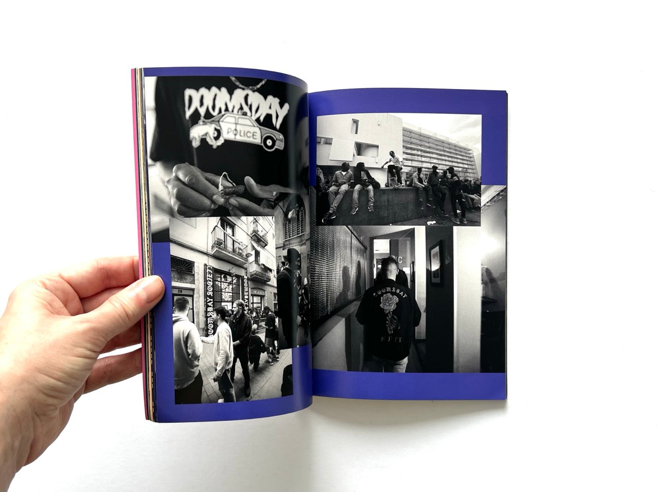 Doomsday Society Issue No. 01 – Interior spread with black-and-white photo collage including street scenes, people gathering, and close-up of hands with branded clothing.