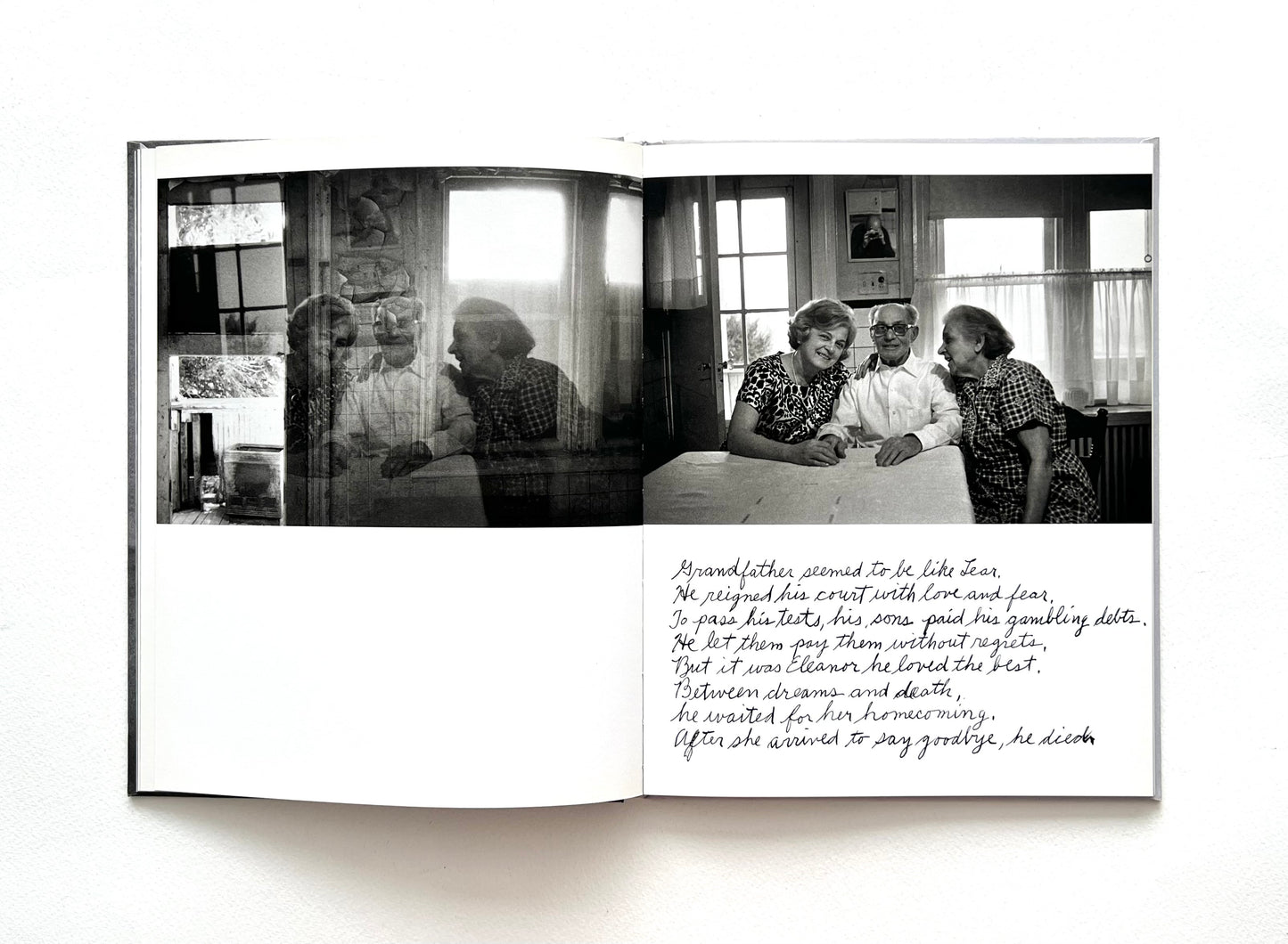 Open book with black and white photograph and hand-written text by Duane Michals on a white background