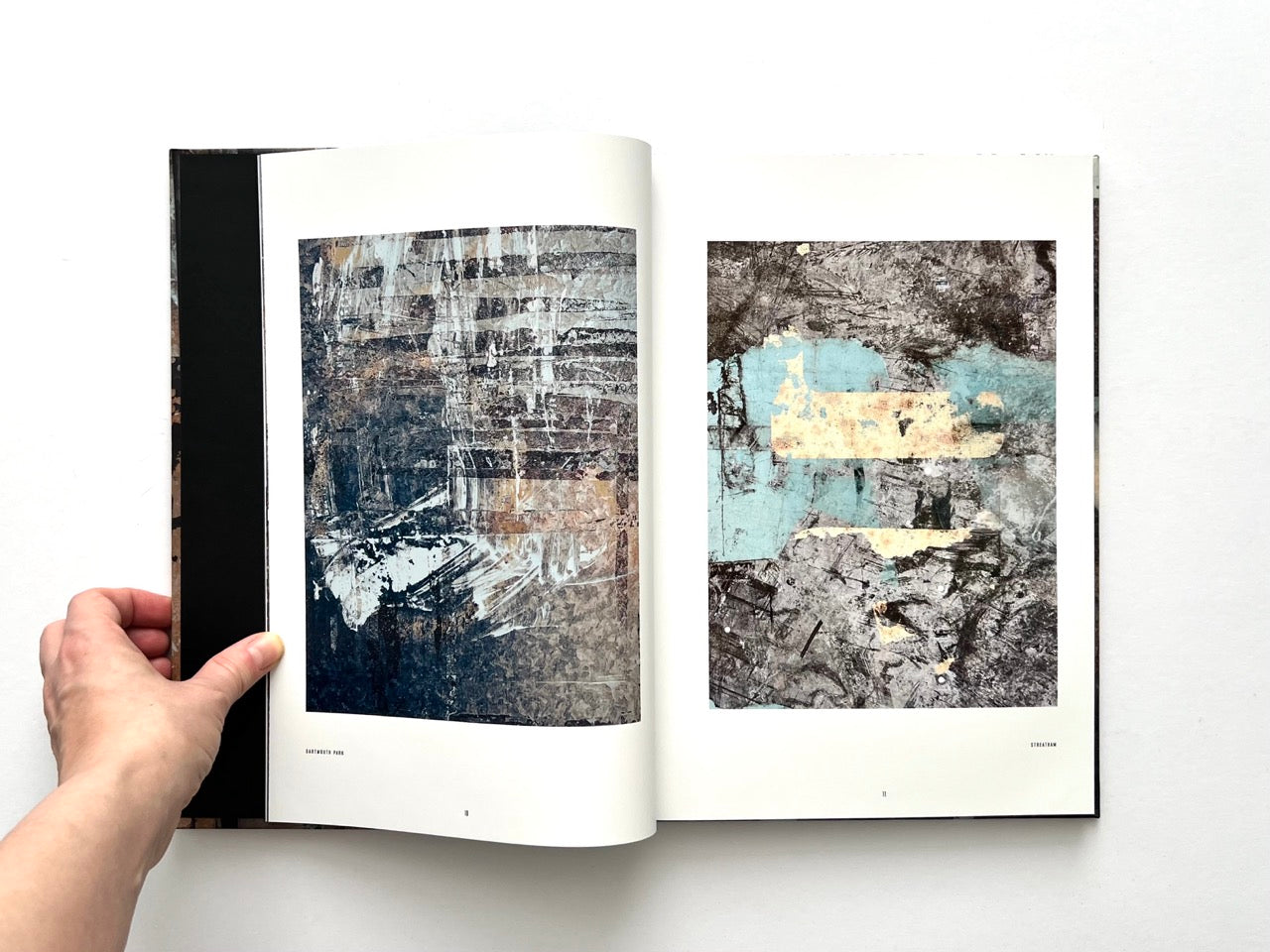 Interior spread from Dubious Splendor: Graphic Works by Rob Sanders 2023–2024 showing two abstract mixed-media works with scraped and layered surfaces