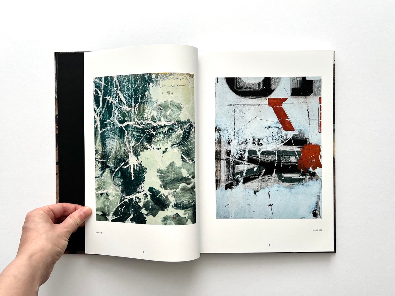 Interior spread from Dubious Splendor: Graphic Works by Rob Sanders 2023–2024 with gestural compositions in green, white and red tones
