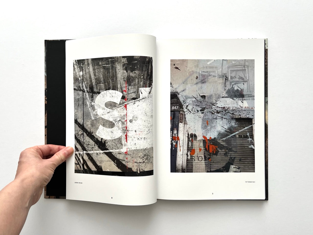 Interior spread from Dubious Splendor: Graphic Works by Rob Sanders 2023–2024 with layered urban textures and photographic fragments