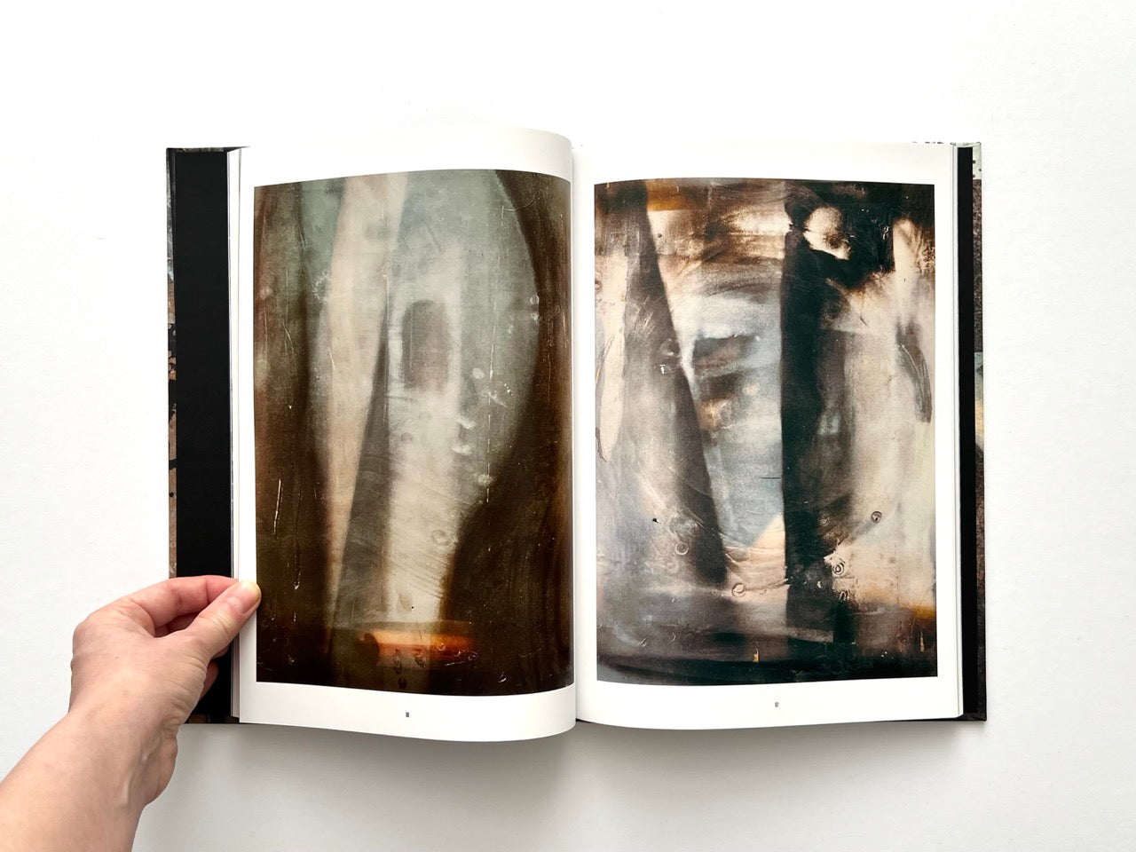 Interior spread from Dubious Splendor: Graphic Works by Rob Sanders 2023–2024 featuring blurred, painterly abstract photographic works