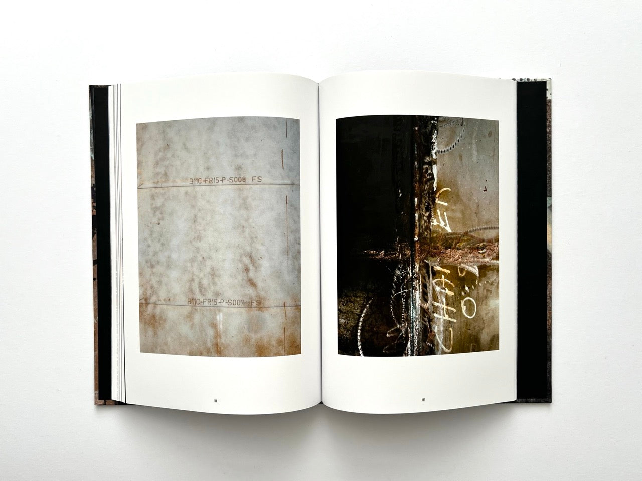 Interior spread from Dubious Splendor: Graphic Works by Rob Sanders 2023–2024 with minimal industrial textures and close-up surface details