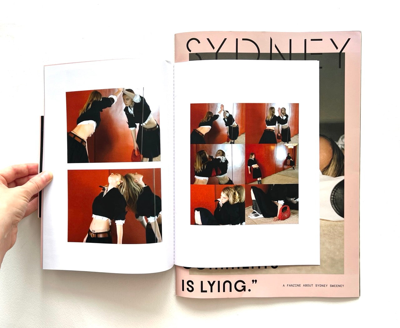 Open magazine with multiple photos of Sydney Sweeney reflected in a mirror.