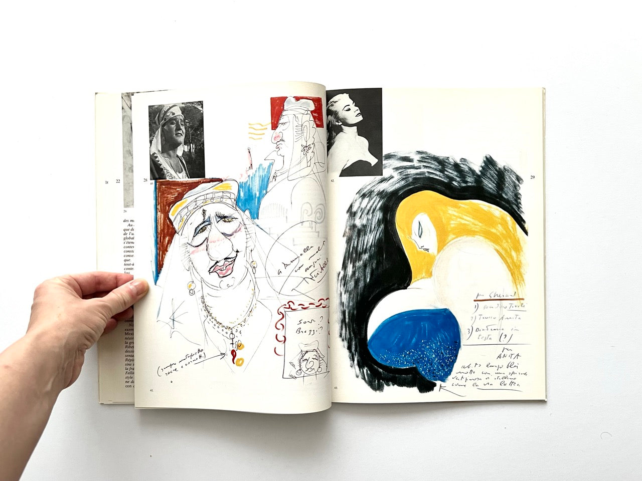 Interior spread showing a coloured caricature of an older woman in a headscarf with handwritten notes on the left page, alongside two small black-and-white film stills. Right page features a large abstract figure in yellow, black and blue with additional handwritten annotations.