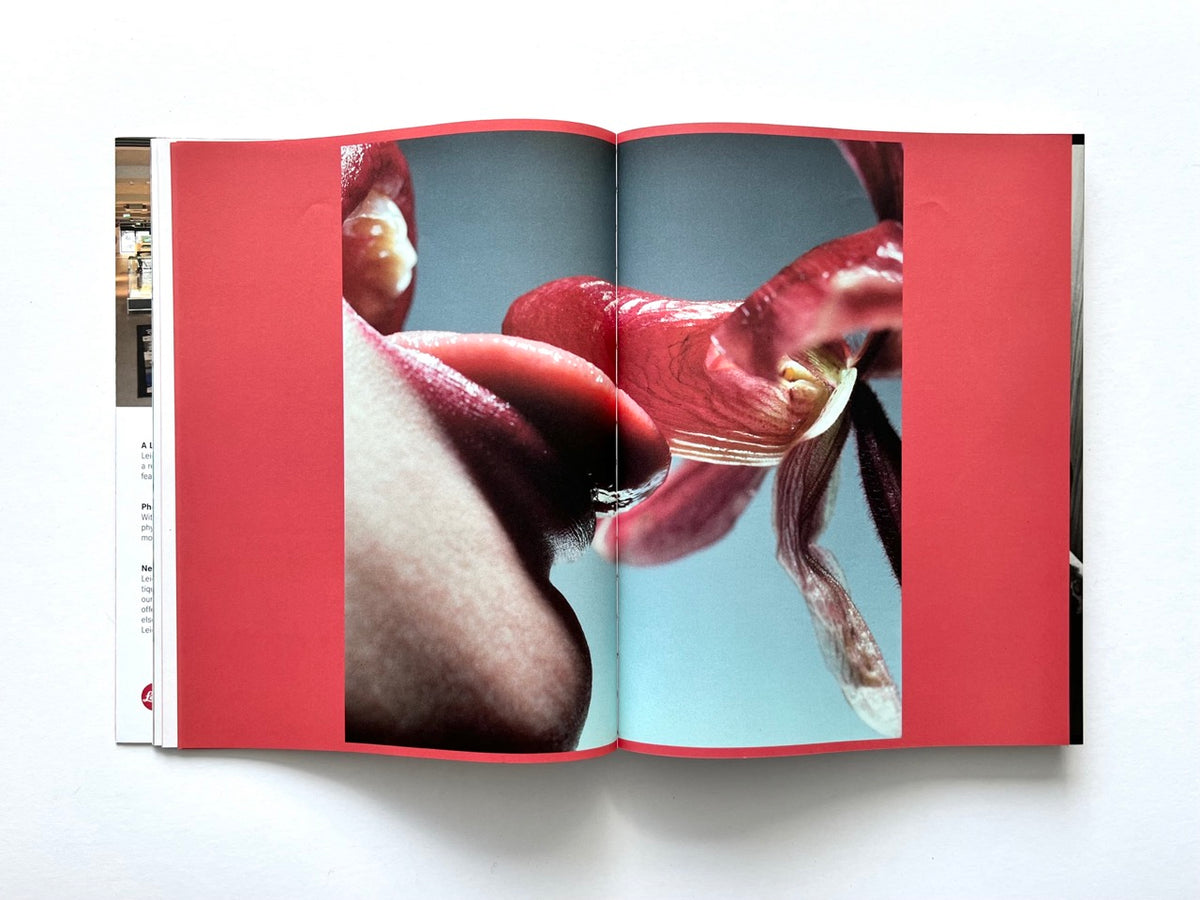 FOAM International Photography Magazine, Issue #35: Lust, Summer 2013. Interior double-page spread featuring an extreme close-up photograph of a mouth and tongue interacting with a flower, framed by vivid red borders.