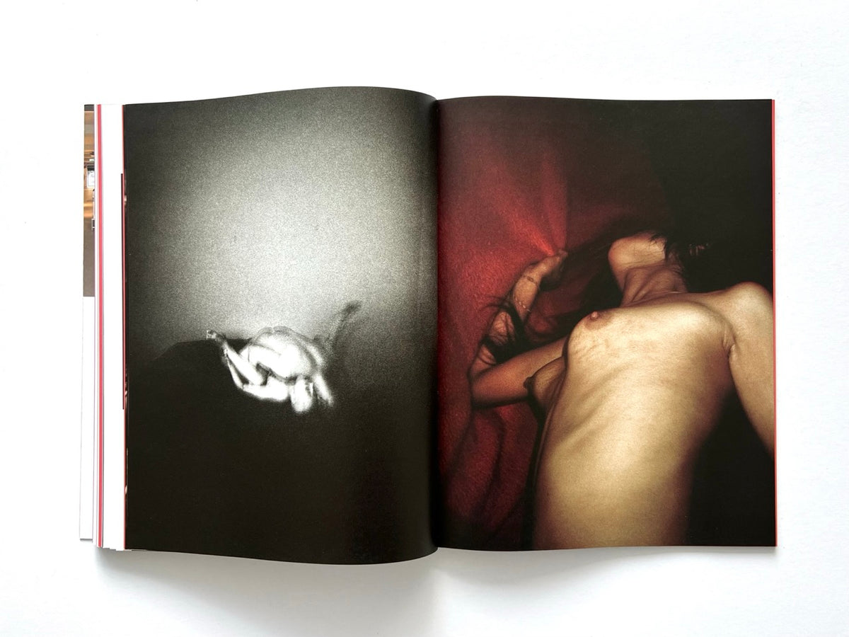 FOAM International Photography Magazine, Issue #35: Lust, Summer 2013. Atmospheric double-page spread featuring a grainy black-and-white photograph of a reclining nude figure opposite an intimate colour photograph of a woman's bare back against deep red fabric.
