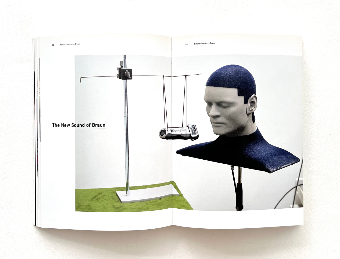 Braun advertisement with a mannequin wearing a blue cap and device on a white background