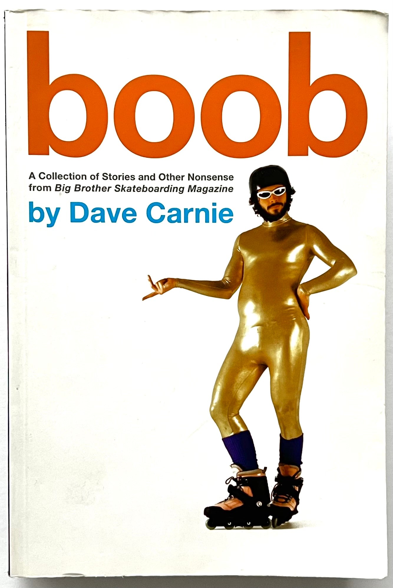 Book cover for “boob” by Dave Carnie, showing a man in a shiny gold full-body suit, helmet, and rollerblades, posing humorously against a white background.