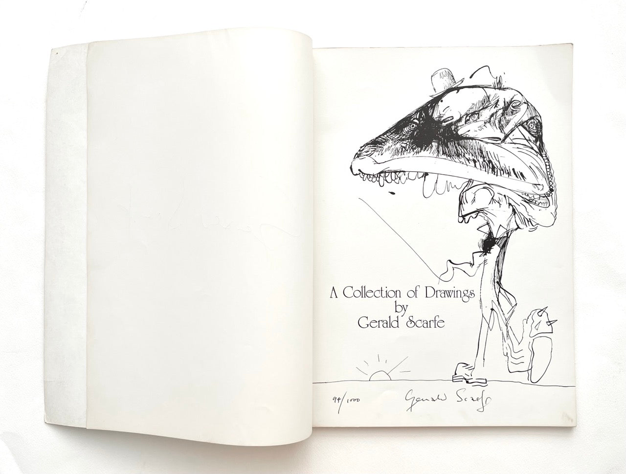 Open book with a drawing of a creature and text 'A Collection of Drawings by Gerald Scarfe' on a white background
