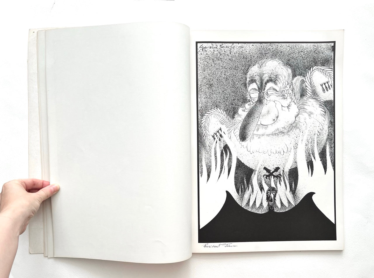 Open book - 'Indecent Exposure' by Gerald Scarfe - displaying a black and white carricature.