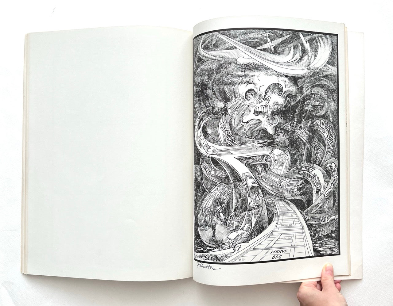 Open book displaying an abstract black and white drawing on a white background