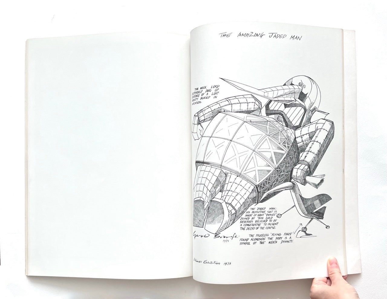 Open book - 'Indecent Exposure' by Gerald Scarfe - showing a detailed black and white illustration of a robot-like character, held open by a hand on a white background.