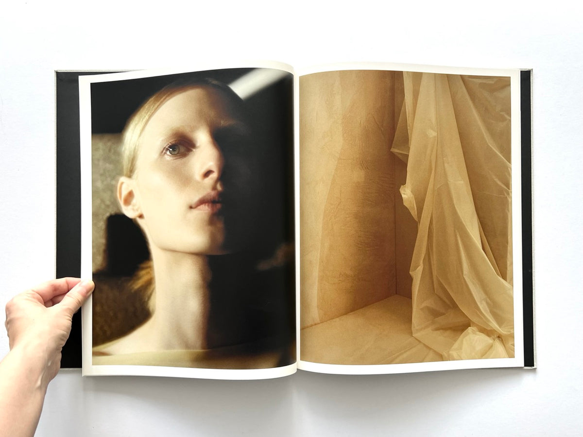 LOEWE Spring Summer 2015 Womenswear, photography by Jamie Hawkesworth, published 2015. Intimate colour portrait of Julia Nobis paired with a warm-toned study of translucent draped fabric.