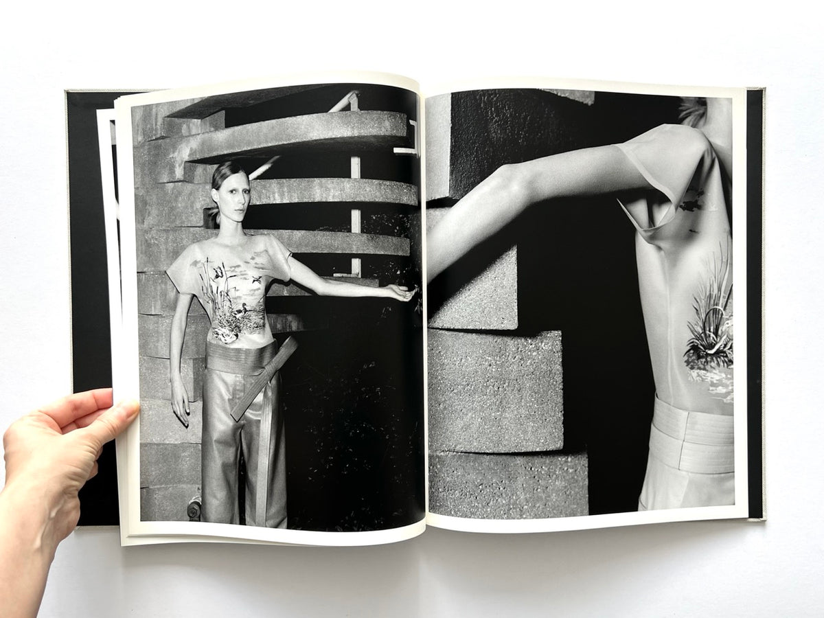 LOEWE Spring Summer 2015 Womenswear, photographed by Jamie Hawkesworth, 2015. Black-and-white fashion editorial featuring Julia Nobis in printed top and wide-leg trousers against sculptural concrete architecture.