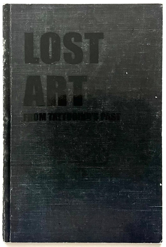Book titled 'LOST ART: FROM TATTOOING’S PAST' with a black cover