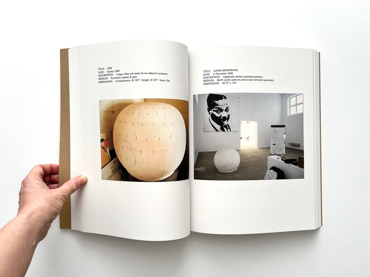 Lutz Bacher: Snow (2013), interior spread showing “Orb” large spherical sculpture and gallery installation with Louis Armstrong image and minimal objects