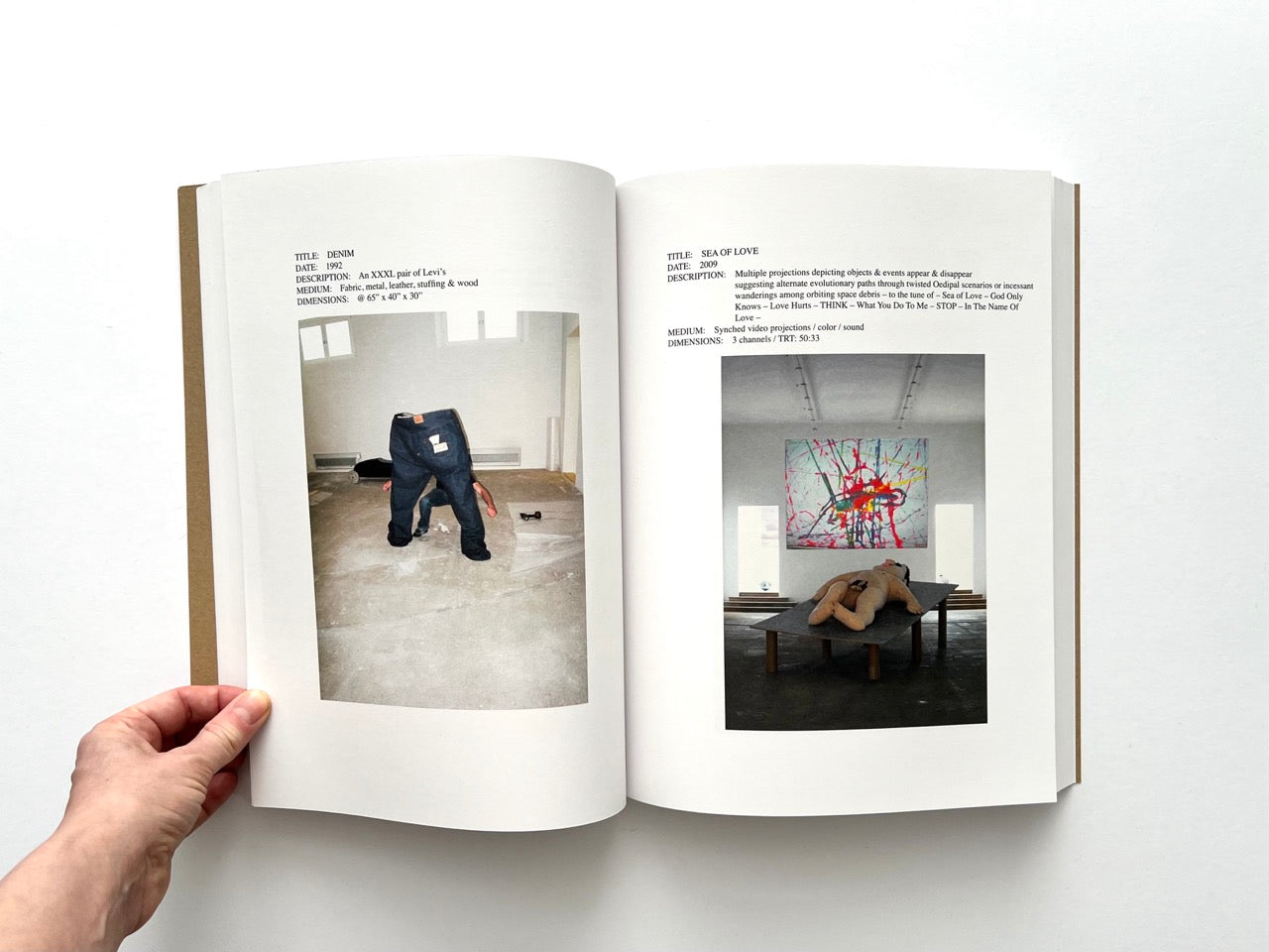 Lutz Bacher: Snow (2013), interior spread with “Denim” oversized jeans sculpture and “Sea of Love” installation with prone figure and abstract painting
