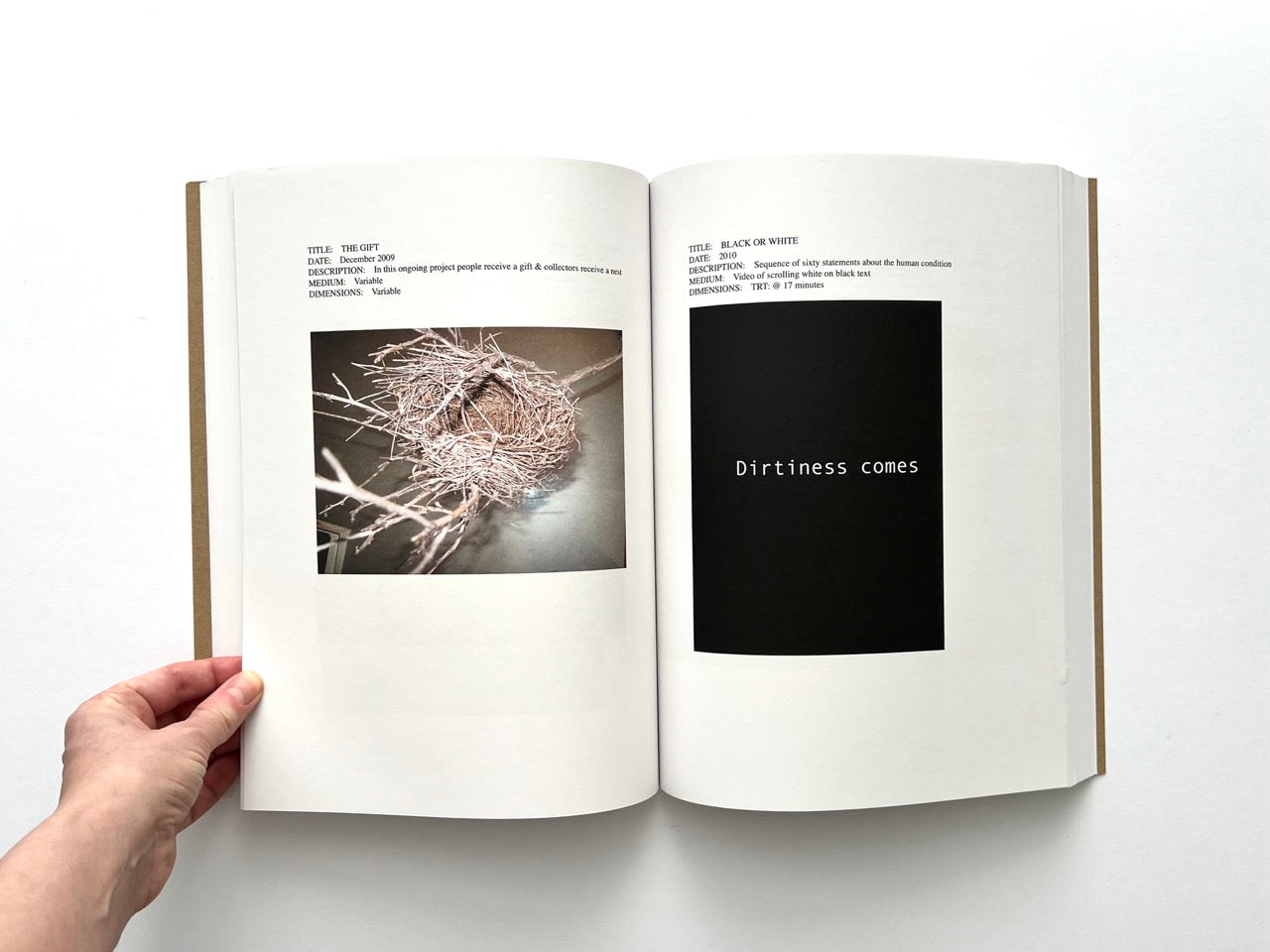 Lutz Bacher: Snow (2013), interior spread showing “The Gift” twig nest sculpture and “Black or White” text work with phrase “Dirtiness comes” on black screen