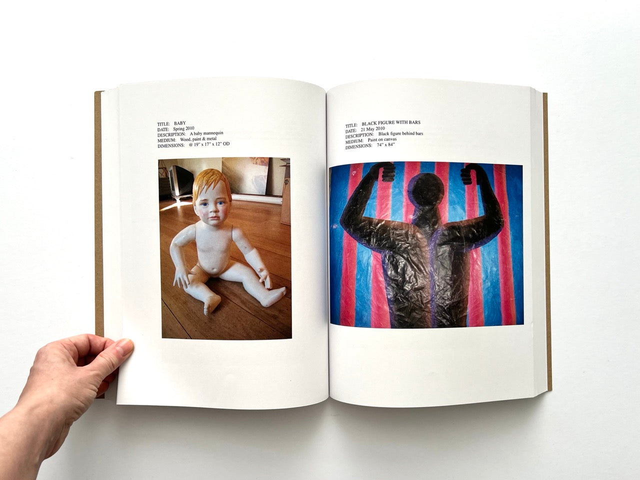Lutz Bacher: Snow (2013), interior spread with hyperreal baby mannequin sculpture and “Black Figure with Bars” painting of silhouetted figure against red and blue stripes