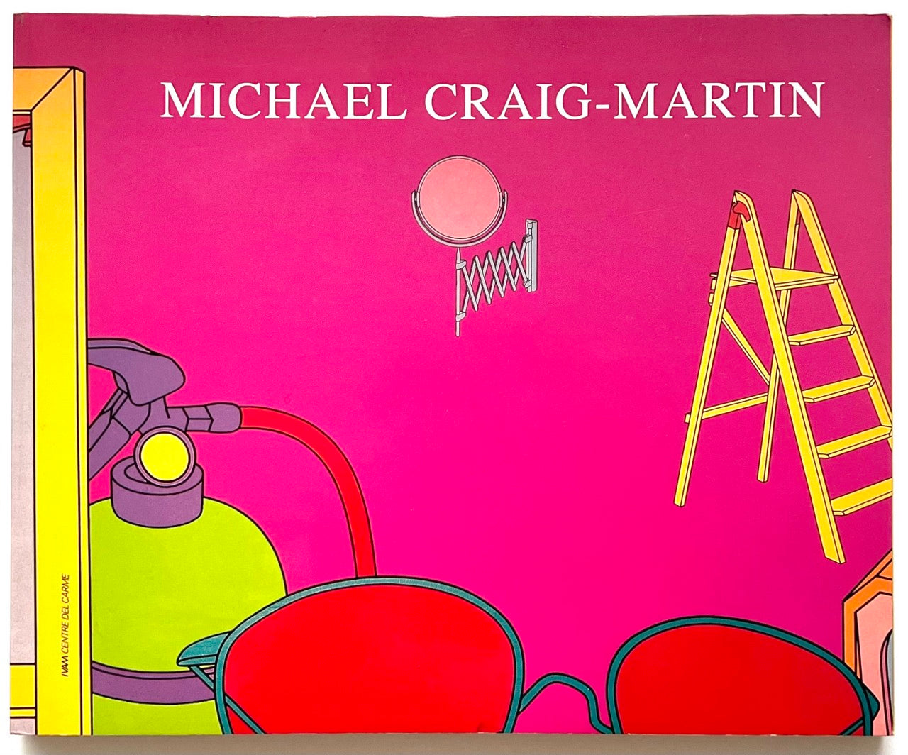 Book cover with 'Michael Craig-Martin' title, colorful objects on a pink background