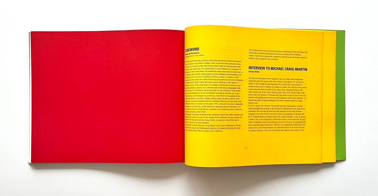 Open book with red and yellow pages on a white background