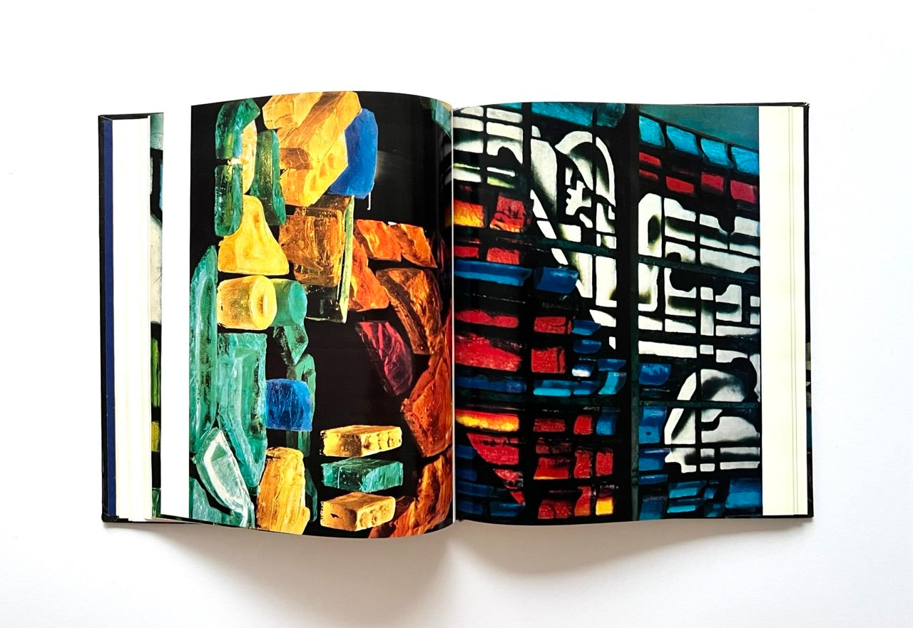 Open book - 'Moderne litauische Glasmalerei' - with colourful abstract stained glass art on each page