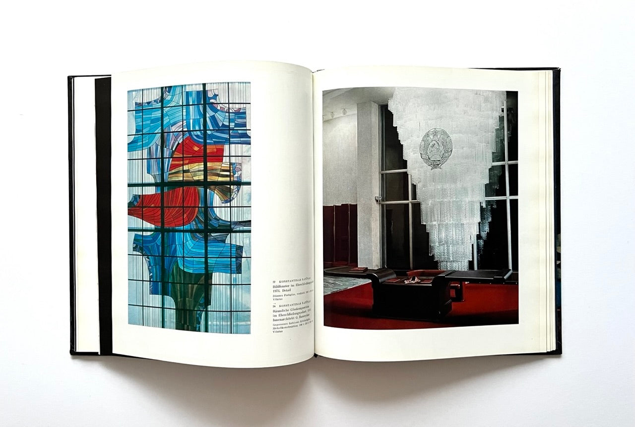 Open book - 'Moderne litauische Glasmalerei' - showing images of stained glass and interior design.