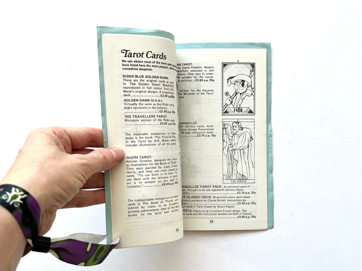 Occult & Allied Equipment by Metaphysical Research Group, undated. Interior pages 14–15 featuring tarot card listings, Rider-Waite and Thoth decks, and illustrations of The Fool and The Hermit.