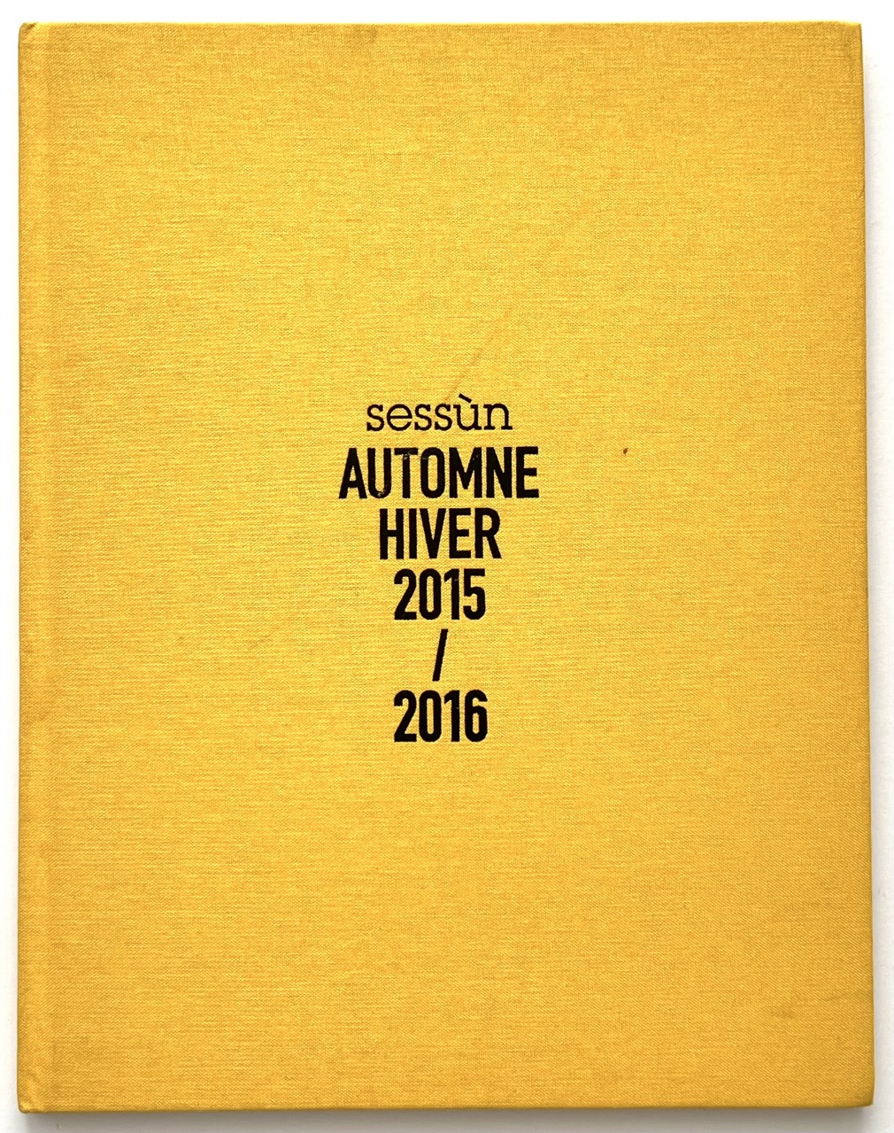 Sessùn Automne Hiver 2015 2016 catalogue, yellow cloth, front cover fashion lookbook