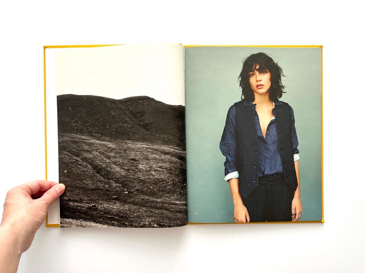 Interior spread from Sessùn Automne Hiver 2015 / 2016 fashion catalogue showing portrait photograph and landscape image from the lookbook