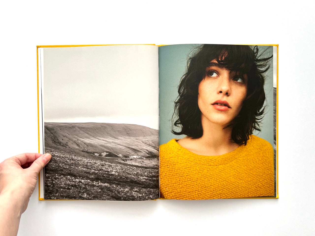 Interior spread from Sessùn Automne Hiver 2015 / 2016 catalogue with landscape photograph and colour portrait in yellow knit