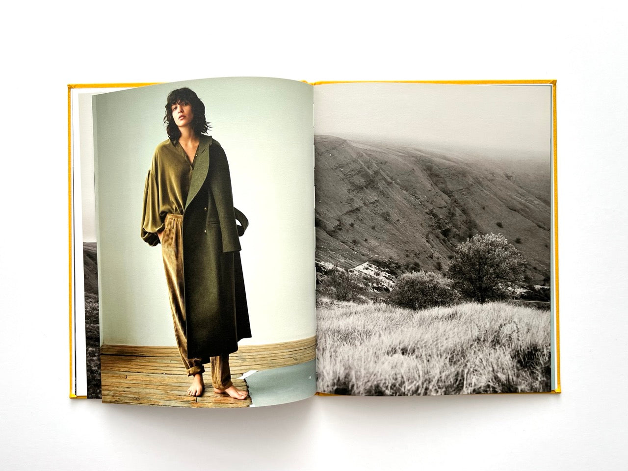 Interior spread from Sessùn Automne Hiver 2015 / 2016 catalogue with studio fashion portrait and lbalck and white andscape photograph