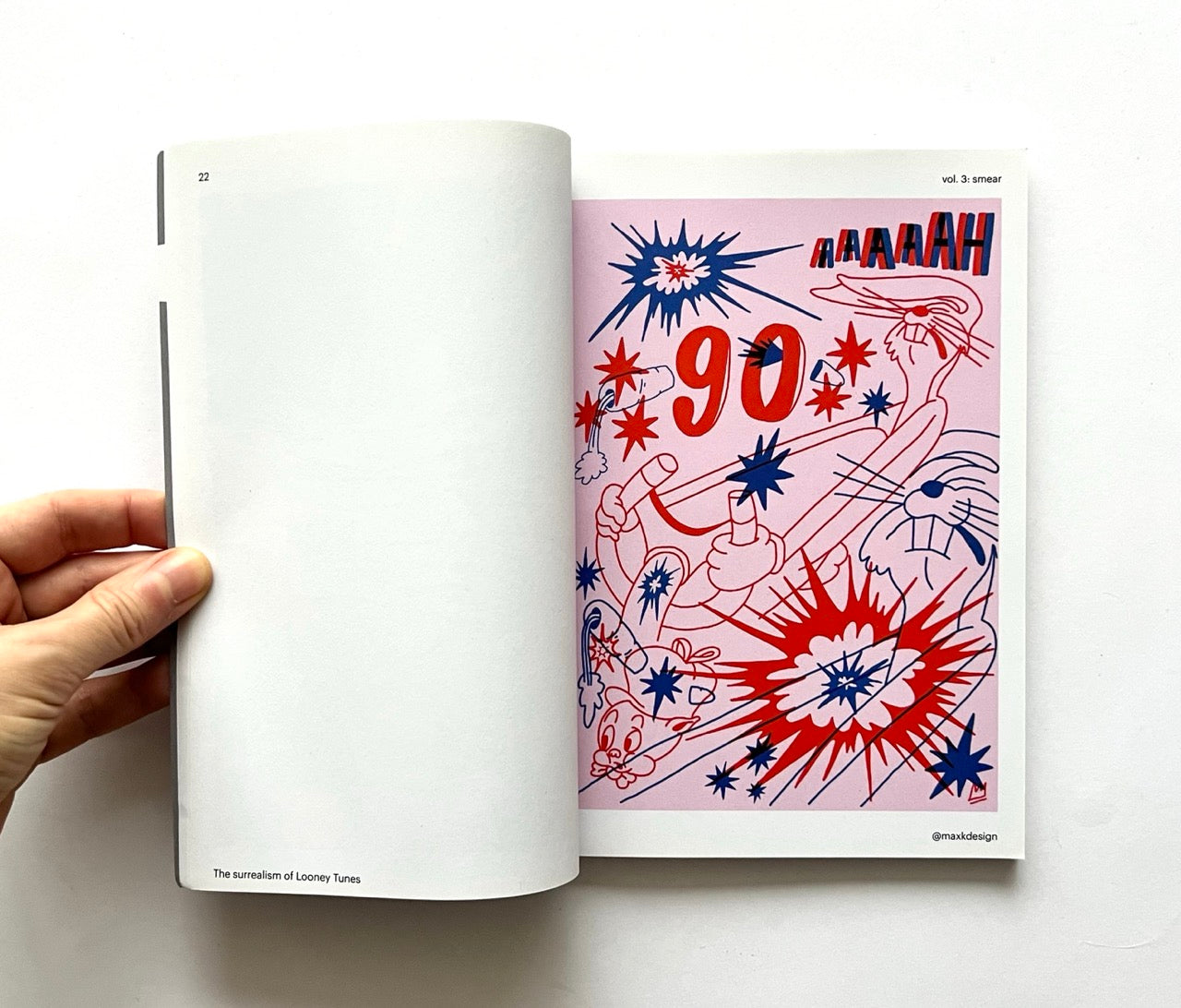 Open book - 'Smear: the surrealism of Looney Tunes vol. 3' - with colorful abstract design on a white background