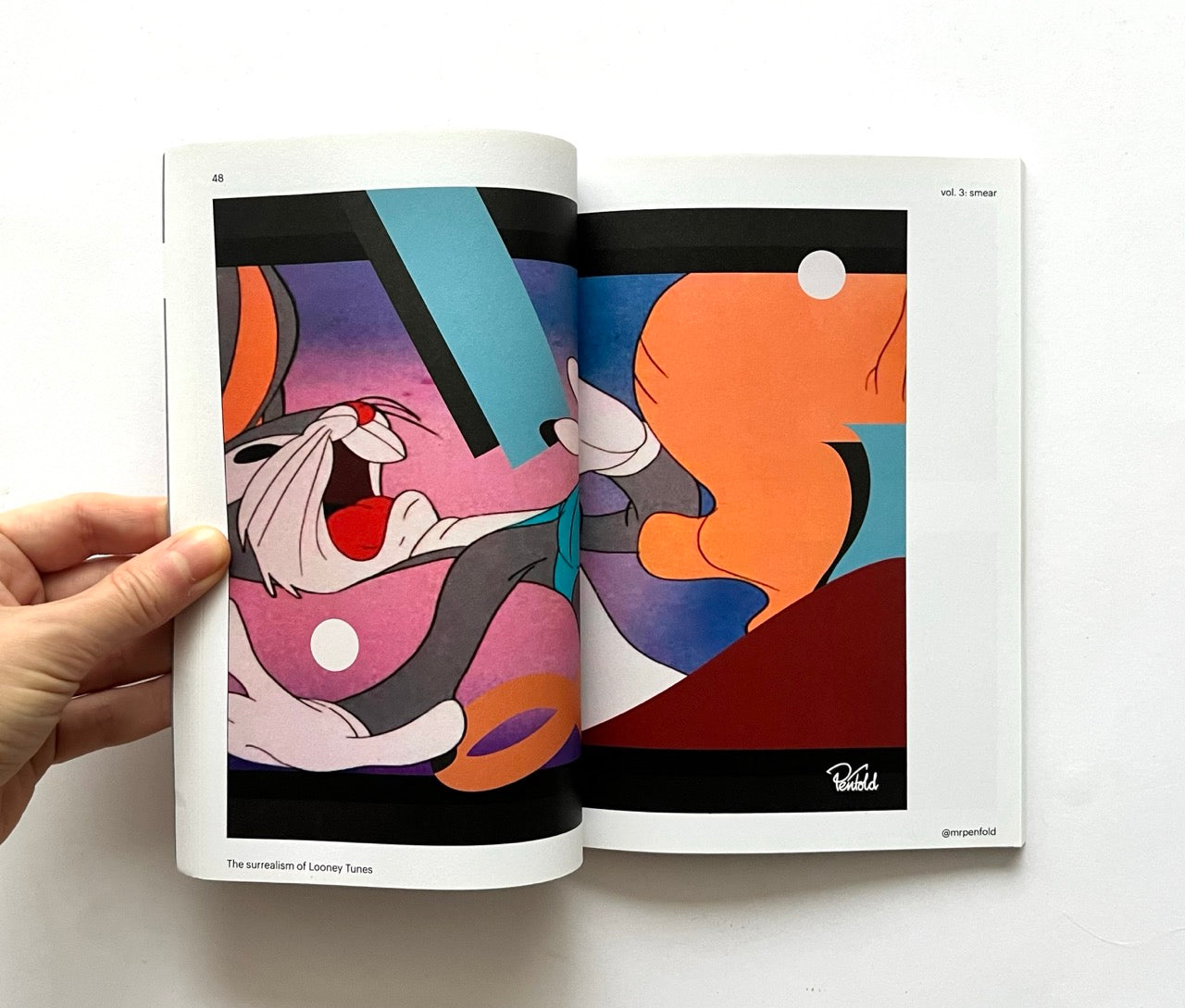 Open book - 'Smear: the surrealism of Looney Tunes vol. 3' - with colorful cartoon illustration of Bugs Bunny.