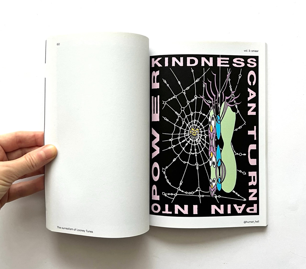 Open book - 'Smear: the surrealism of Looney Tunes vol. 3' - with a poster design featuring a spider web and text.