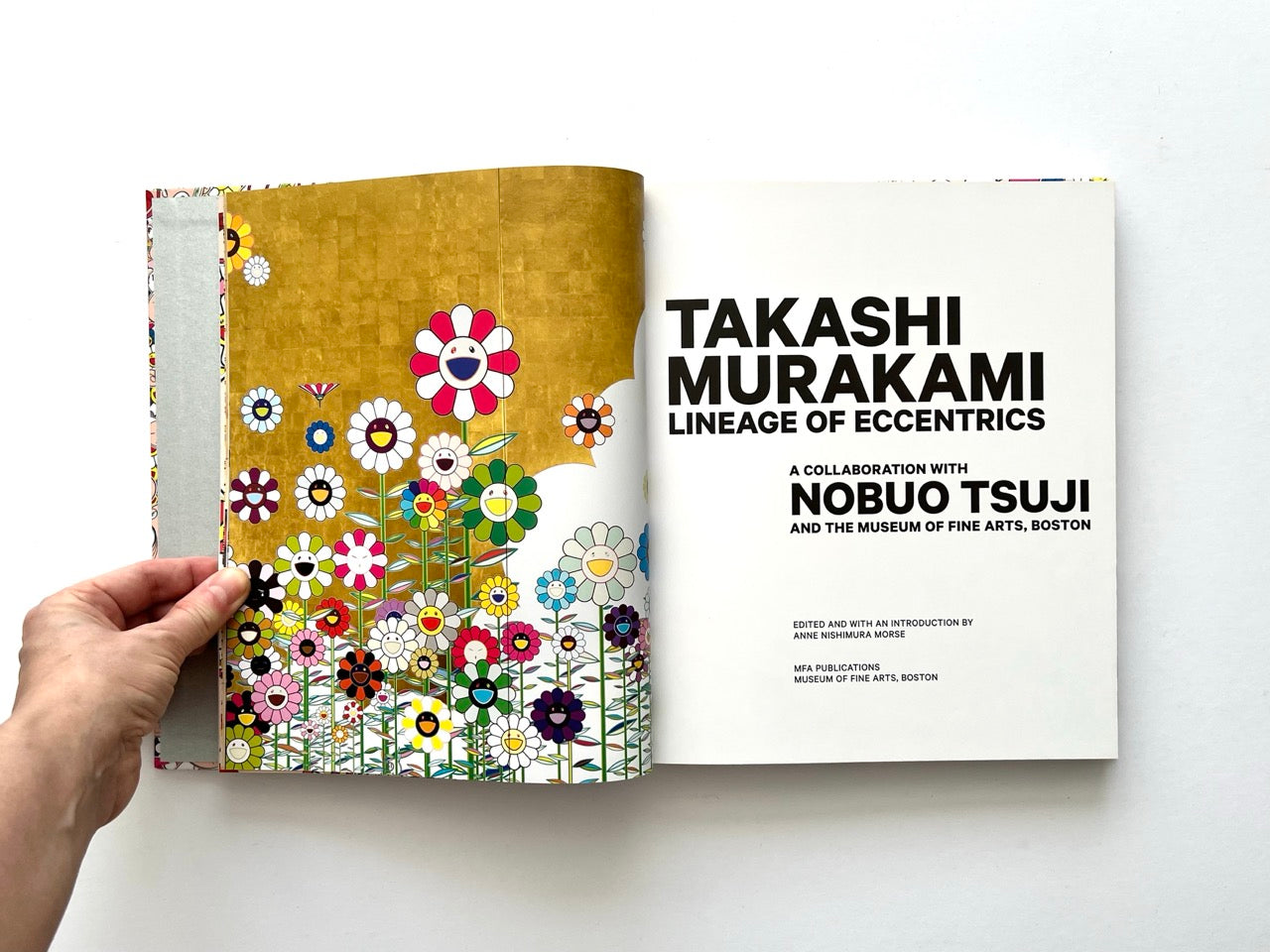 Takashi Murakami Lineage of Eccentrics title page with bold typography and gold floral artwork with smiling flowers on the left