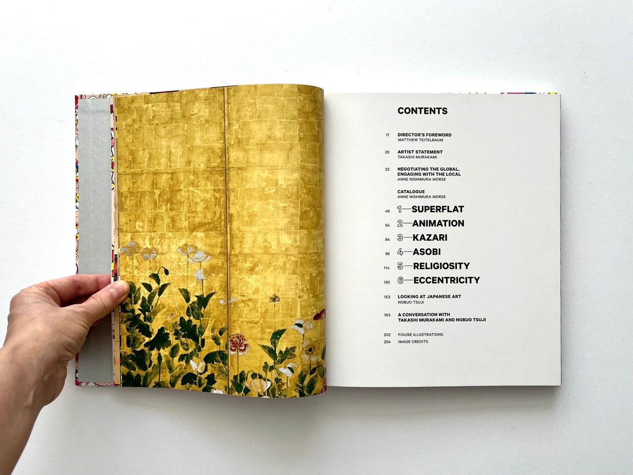 Takashi Murakami Lineage of Eccentrics contents page next to a gold background with delicate painted plants in traditional Japanese style