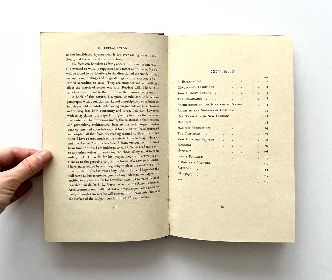 Open book - "The Architecture of a New Era' - with text and table of contents on a white background
