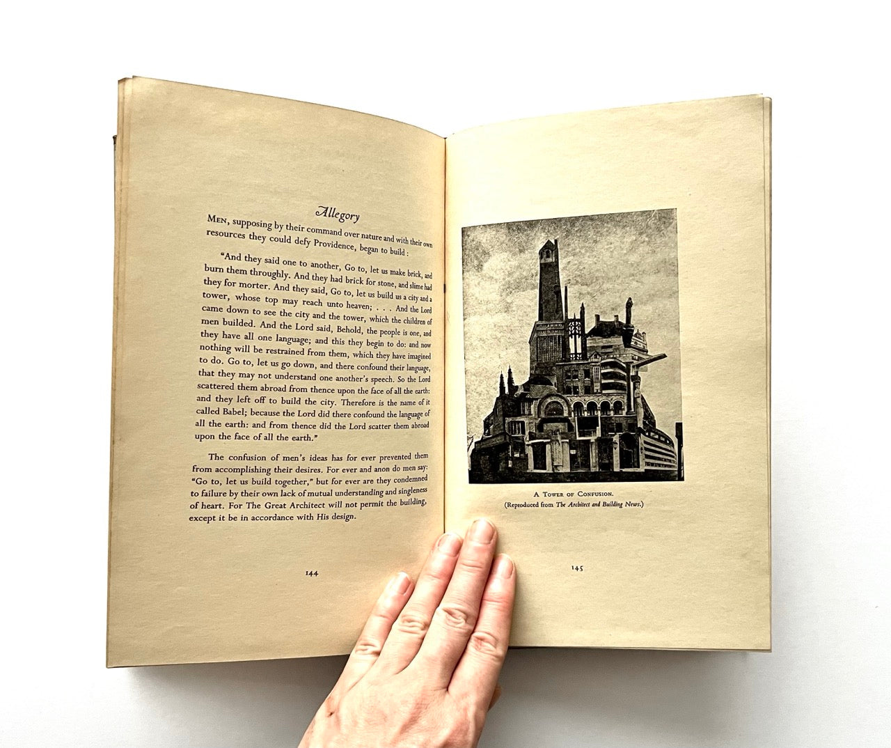 Open book - "The Architecture of a New Era' - with text and an illustration of a tower on a white background