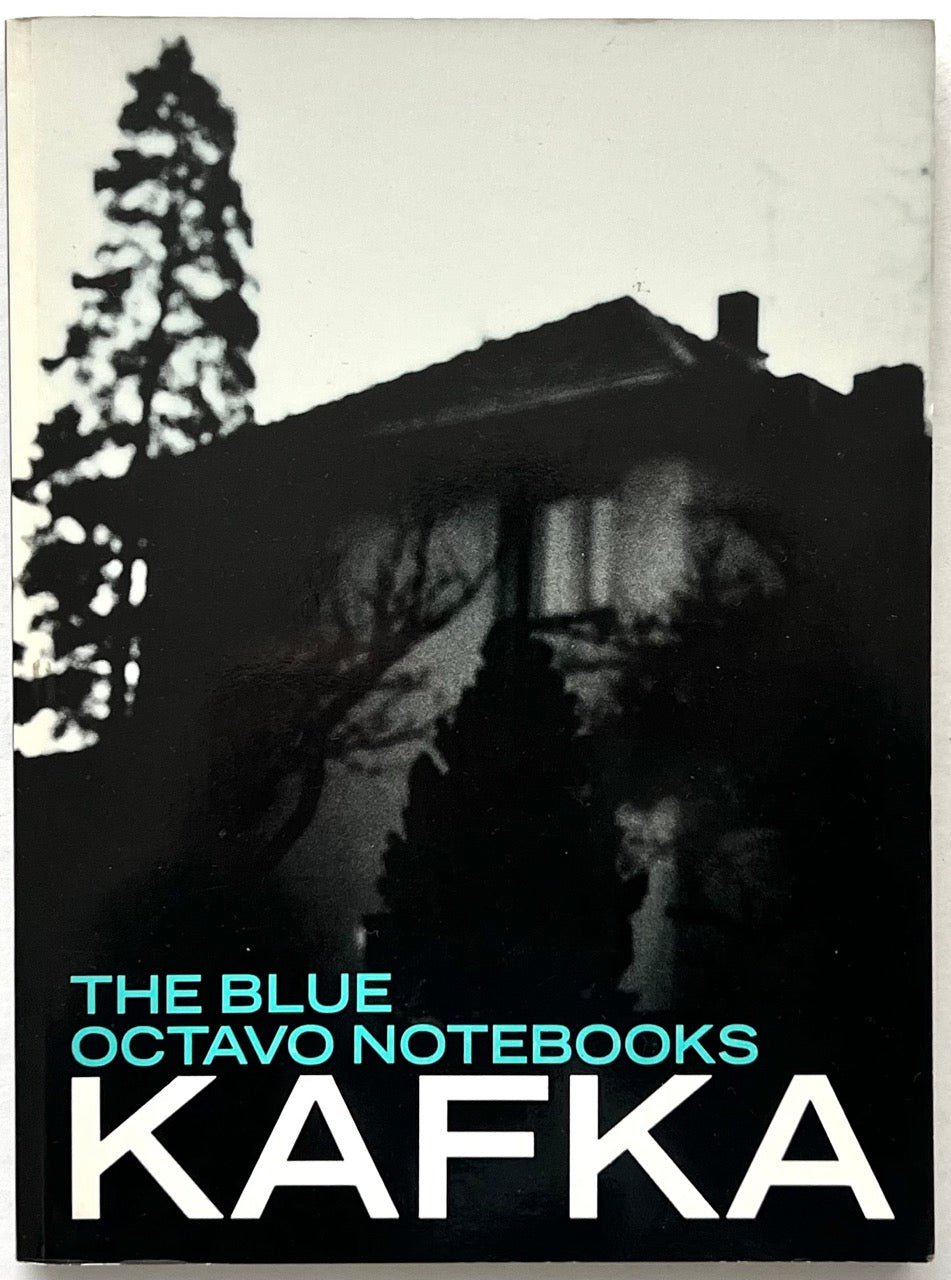 Franz Kafka, The Blue Octavo Notebooks (1991, Exact Change). Front cover featuring an atmospheric black-and-white photograph of a house and trees, with turquoise lettering and bold white typography.