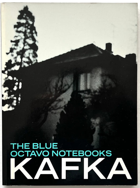 Franz Kafka, The Blue Octavo Notebooks (1991, Exact Change). Front cover featuring an atmospheric black-and-white photograph of a house and trees, with turquoise lettering and bold white typography.