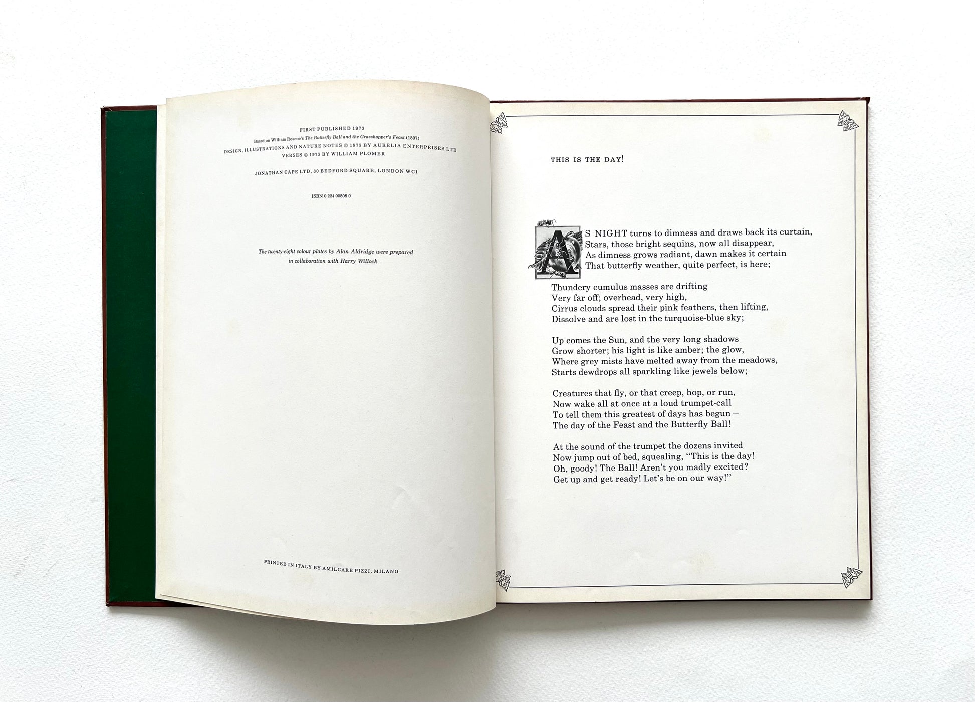 Open book with text and a small illustration on a white background