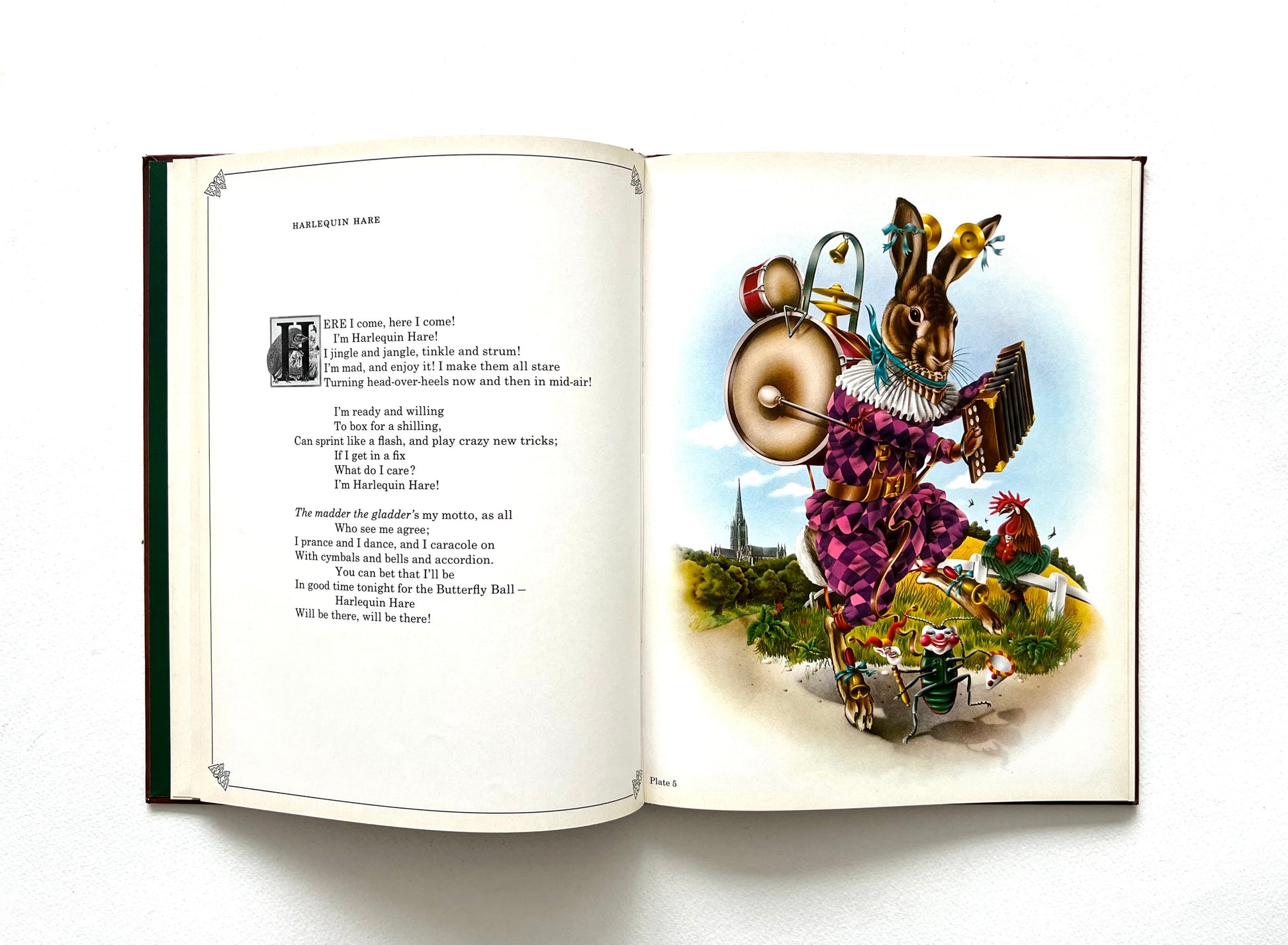 Open book with colorful illustration by Alan Aldridge of a hare in harlequin outfit in a fantasy setting on a white background
