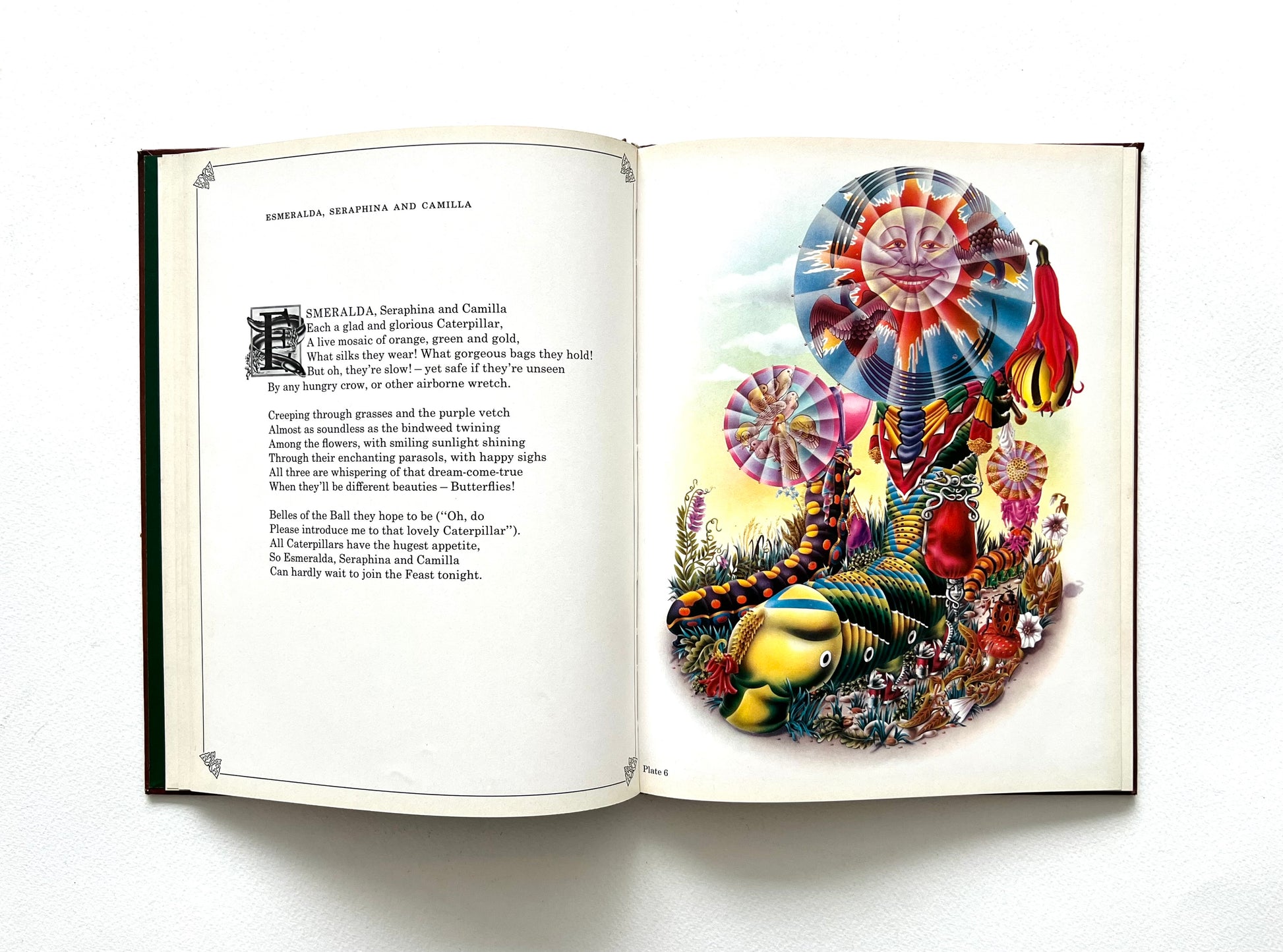 Open book with colorful illustration by Alan Aldridge of a whimsical caterpillar and text on a white background