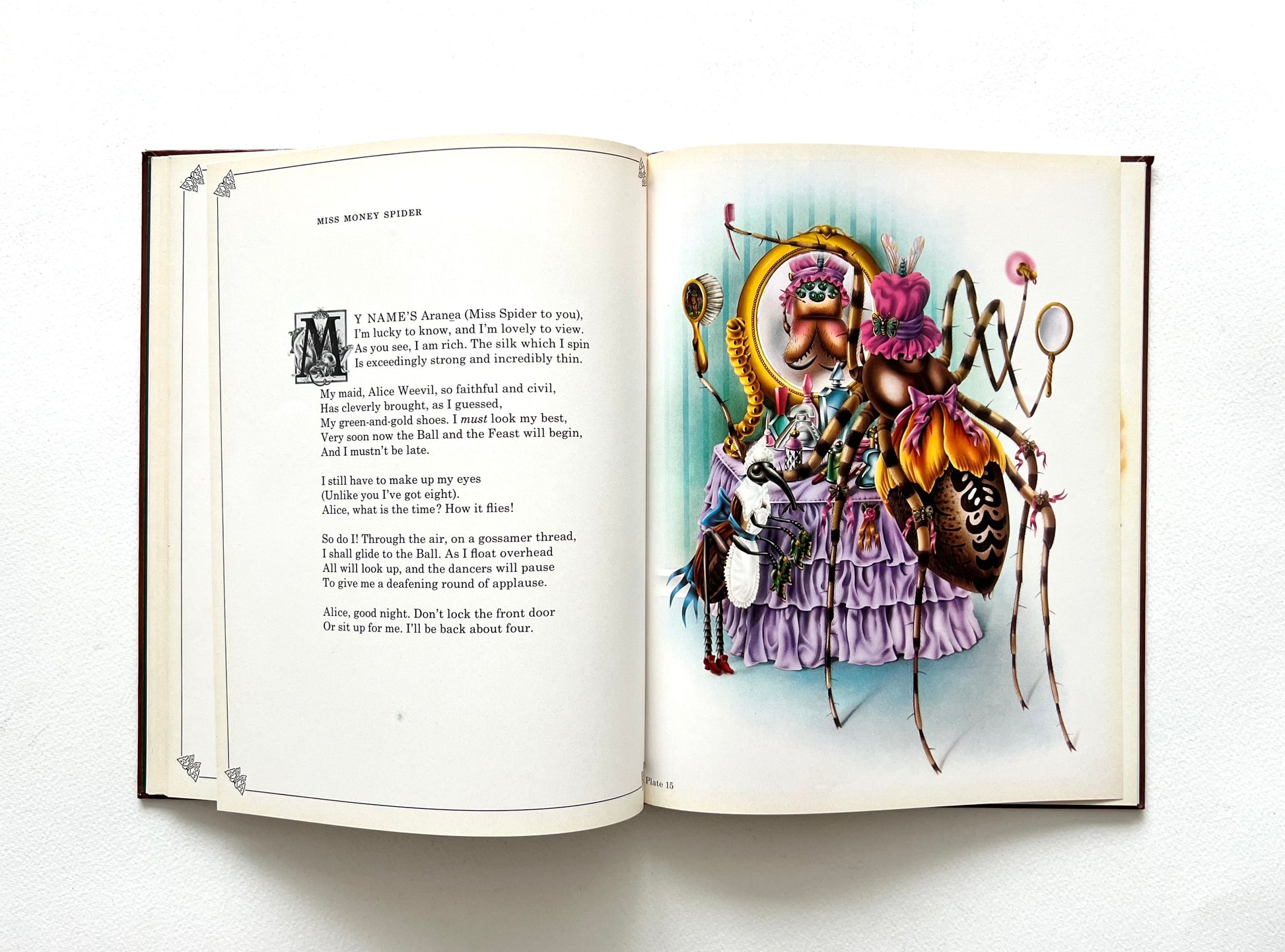 Open book with a colorful illustration by Alan Aldridge of a beetle-like creature on a white background