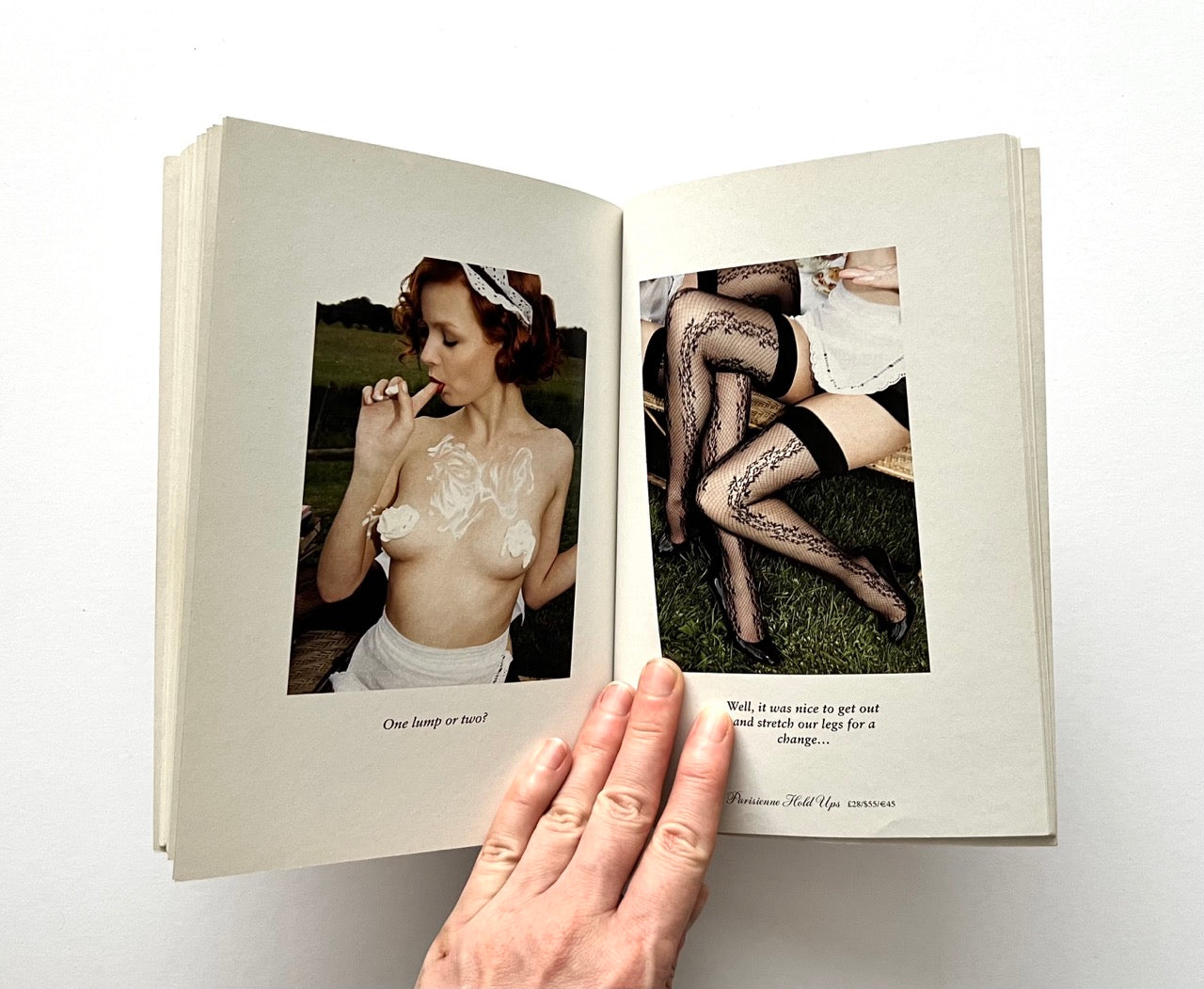 Open book - 'The Lady of the Manor' by Agent Provocateur - with thwo erotic photographs of women 